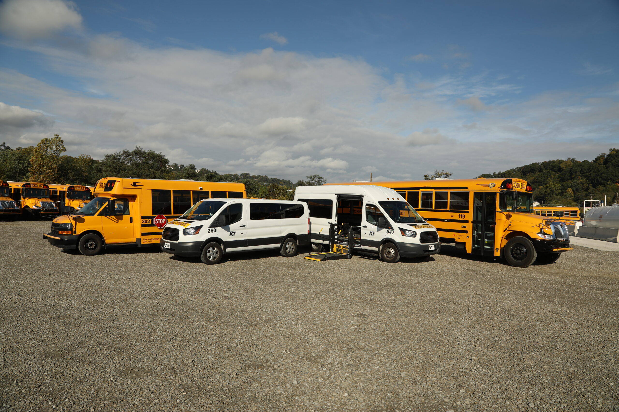 Four Krise buses and vans show their full suite of vehicles.